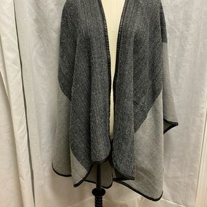 7) Charlie Paige black and grey cape.